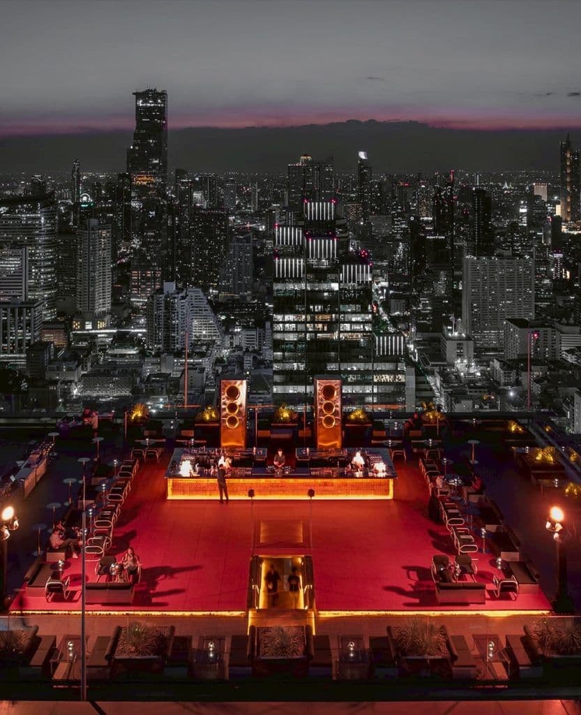 AETHER Bangkok rooftop bar with panoramic city views at sunset